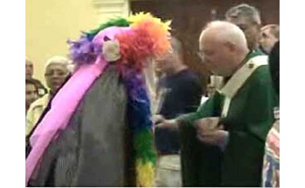 Archbishop Niederauer giving communion to a homosexual